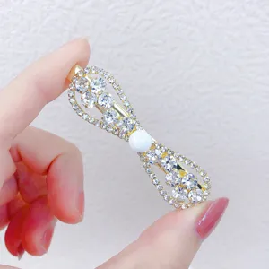 Rhinestone bow hair clip detail shot, elegant crystal zircon hair barrette with pearl.