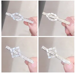 Detailed view of the rhinestone geometric hair clip, showcasing sparkling crystal details.