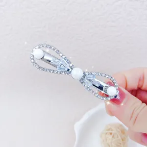 Exquisite rhinestone and zircon hair clip with elegant pearl details for sweet daily styling.