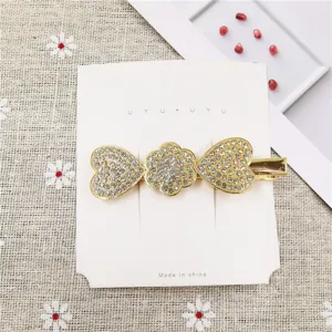 Gold rhinestone heart hair clip for women, elegant duckbill hairpin with sparkling crystals.