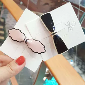 Korean style cute bow acrylic hair clips set, fashionable women side clip and hair accessories.
