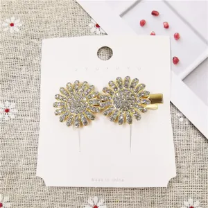 Detailed view of stunning rhinestone flower duckbill hair clip, sparkling crystal metal design.