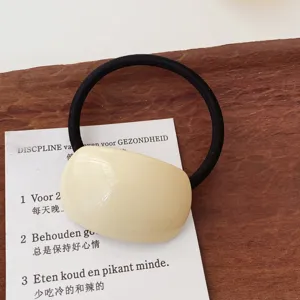Minimalist milk tea color hair tie with black elastic band, stylish sweet hair accessory.