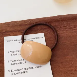 Minimalist milk tea color resin hair tie, sweet and elegant daily hair accessory detail.