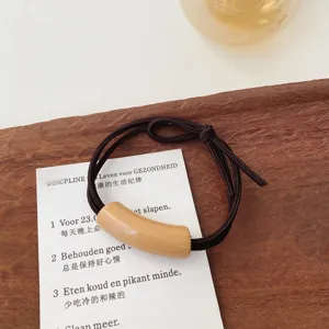 Milky tea color minimalist hair tie and rope with chic curved tube accessory for daily styling.