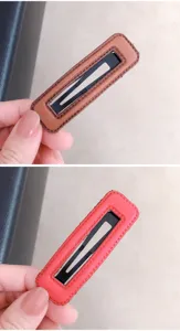 Close-up detail of rectangular PU leather wrapped hair clips with neat edge stitching.