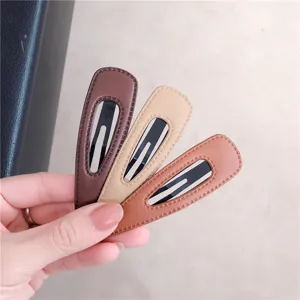 Stylish leather BB hair clips set, minimalist teardrop side clips for daily chic hairstyles.