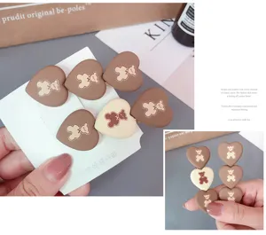 Cute heart-shaped bear design duckbill hair clip for sweet daily hairstyles and styling.