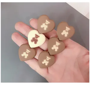 Cute heart-shaped hair clips with lovely bear pattern design, perfect for sweet daily styling.