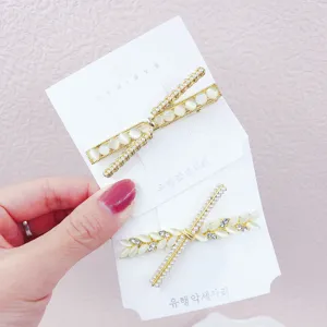 Gold-tone cat eye stone and cubic zirconia hair clip set, elegant side hair pin for women.
