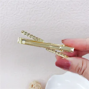 Golden metal hair clip detailed view, stylish side bangs hairpin for women daily hair styling.