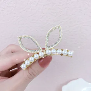 Pearl rhinestone cat ear hair clip detail view, elegant gold metal side hairpin for women.