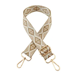Courroie de sac de remplacement tissée réglable avec fils métalliques et motif géométrique ethnique.