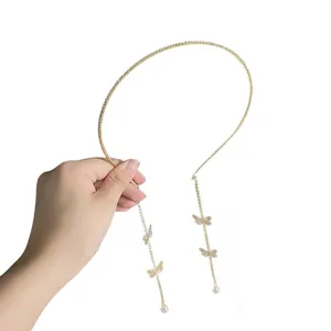 Gold rhinestone thin headband with pearl butterfly tassel drapes, chic retro hoop.