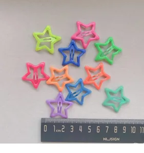 Colorful star hair clips detail view, cute hair accessories for kids and babies, candy colors.