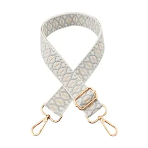 Jacquard woven replacement bag strap with adjustable gold metal hardware, stylish and durable.
