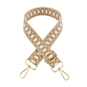 Adjustable woven replacement bag strap with chic jacquard geometric pattern and gold hardware.