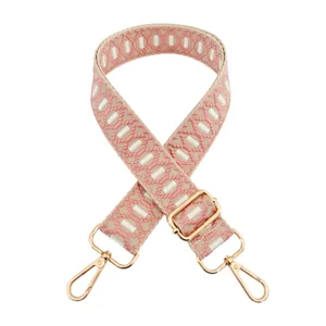 Adjustable replacement bag strap with pink geometric jacquard embroidery and gold hardware.