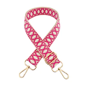 Adjustable woven replacement bag strap with jacquard pattern and premium gold metal hardware.