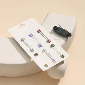 Colorful plastic safety pin detail shot, ideal for hijab scarf fixing and anti-exposure use.