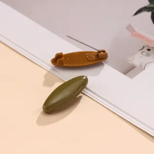Plastic safety pin brooch detail, anti-glare hijab scarf buckle accessory close-up