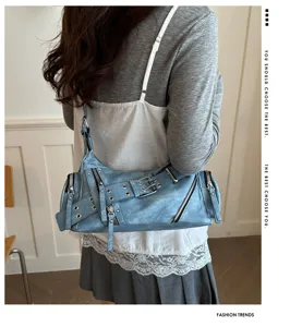 Vintage distressed blue motorcycle shoulder bag with buckle details and zippers view