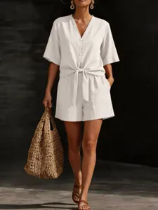 Casual summer two-piece outfit with V-neck button-down short sleeve top and matching shorts.