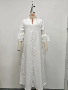 Women's solid white V-neck long sleeve ruffle hem maxi dress elegant casual wear.