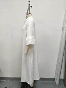 Detail view of solid white lotus leaf sleeve long dress, elegant mock neck and minimalist style.