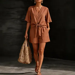 Women brown short sleeve V-neck button down shirt and tie waist casual shorts set.