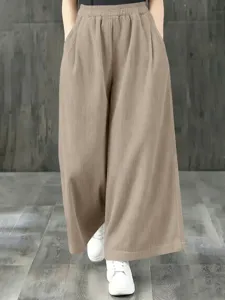 Pantalon large taille haute pour femme avec taille élastique et texture côtelée style décontracté.