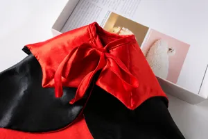 Detailed view of the red and black satin pet cape, perfect for Halloween and holiday dress-up.