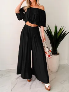 Stylish off-shoulder crop top and wide-leg pants two-piece set detail view, fashion look.