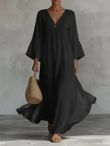 Elegant black boho maxi dress featuring deep V-neck and bell sleeves for holiday styles.