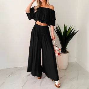 Black off-the-shoulder crop top and wide-leg pants two-piece set, stylish and comfortable outfit.