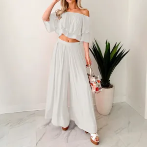 White off-shoulder crop top and wide leg pants two-piece set for women fashion casual wear.