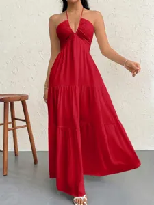 Detail shot of the sexy red halter neck tiered maxi dress showing deep V-cut and soft fabric.