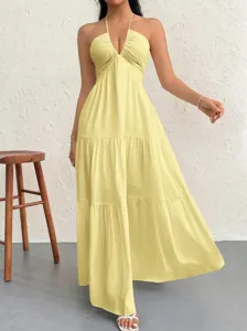 Detail view of the stylish yellow halter deep V maxi dress, perfect for summer parties and beach.