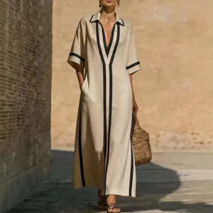 Abito lungo casual in lino beige con finiture a contrasto nere, scollo a V per donne.