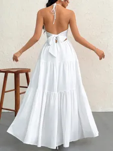 Detailed view of the elegant white backless halter tiered long dress for summer style.