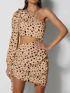 Detail view of sexy one-shoulder leopard print cutout dress with ruched hip-hugging design.