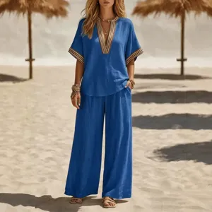 Women casual blue two-piece set V-neck top and wide-leg trousers for beach vacation.