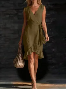 Detail view of the elegant summer V-neck sleeveless wrap dress with waist tie and ruffle hem.