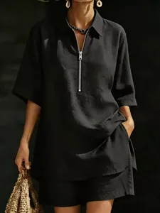 Detail shot of women summer short sleeve zip shirt and shorts set loose casual two piece outfit