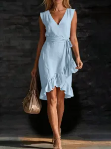 Light blue V-neck sleeveless wrap dress featuring a belted waist and trendy ruffle hem.