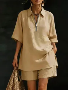 Detail view of the stylish beige linen-style short sleeve shirt and matching shorts set.