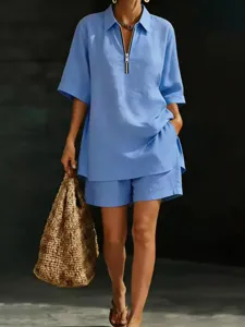Detail shot of women's short-sleeve button-up shirt and shorts summer two-piece outfit.