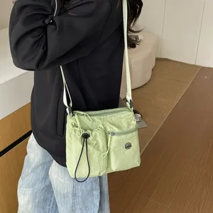 Detail view of the lightweight casual crossbody bag with multiple pockets and adjustable strap.