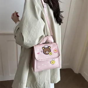 Leuke roze cartoon beer kinderen schoudertas met strik, stijlvolle PU lederen handtas.
