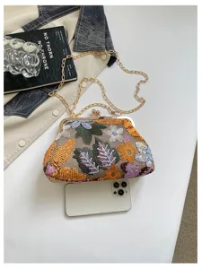 Borsa a tracolla chic in stile cinese ricamata con catena e chiusura a scatto elegante.